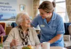 Care Assistant supporting an elderly resident in a care home in South Shields, United Kingdom.