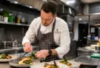 Professional hotel chef preparing meals in a luxury hotel kitchen in Knutsford, Cheshire.